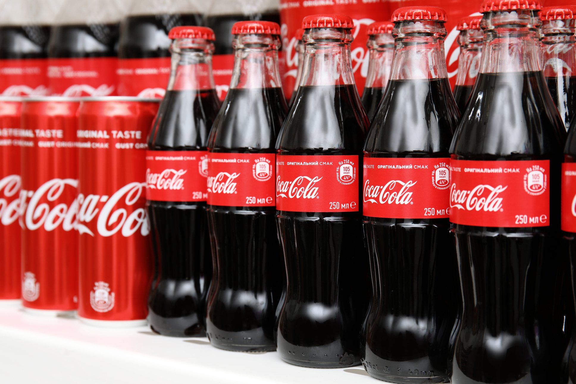 MYKOLAIV, UKRAINE - NOVEMBER 14, 2018: Coca-Cola Cans and Bottles on Display in Store